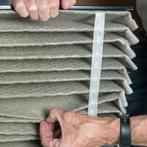 Landlord Showing Tenant's Dirty Air Filter